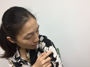 Woman holding a chameleon for the first time